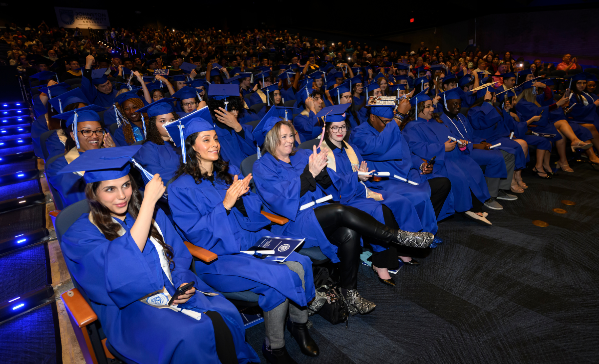 Students in Auditorium at the 54th Commencement all in Blue