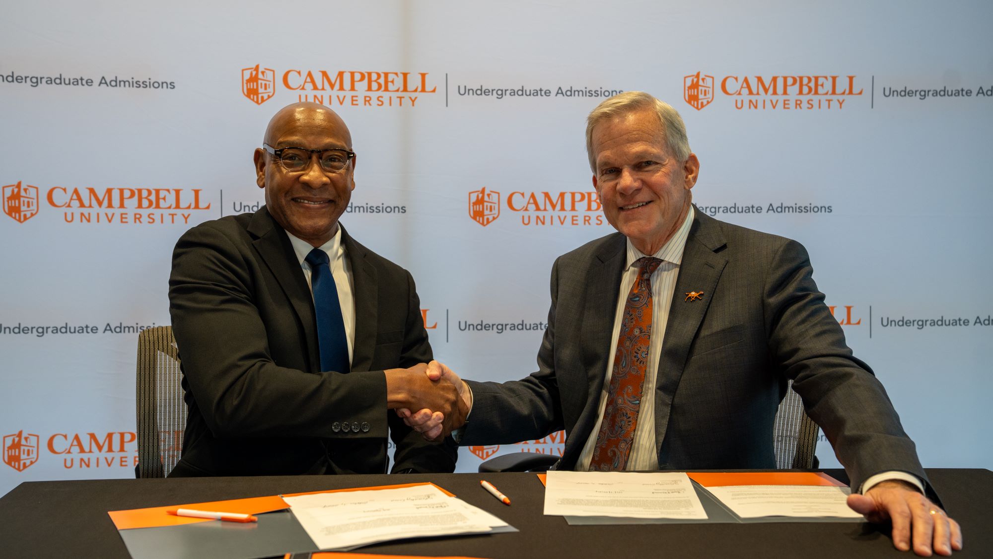 Dr. Marc Davis Shaking hands with Campbell College president