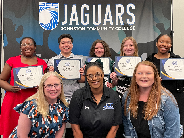 Staff and Students displaying their awards