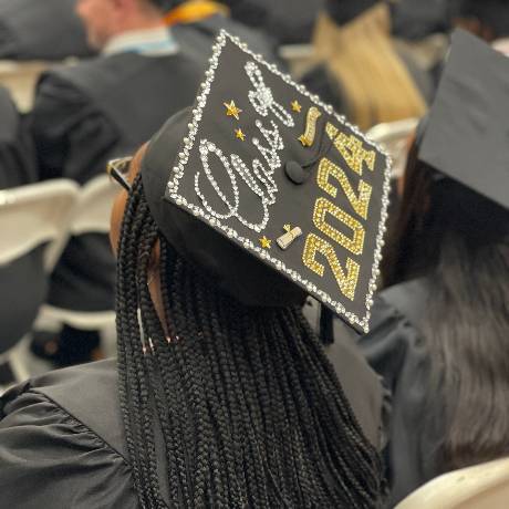 Image of women wearing a decorated 2024 Graduation Cap