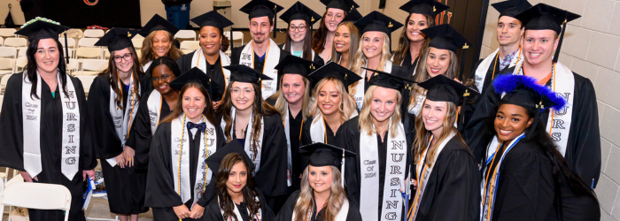 JCC Graduate student with decorated cap 