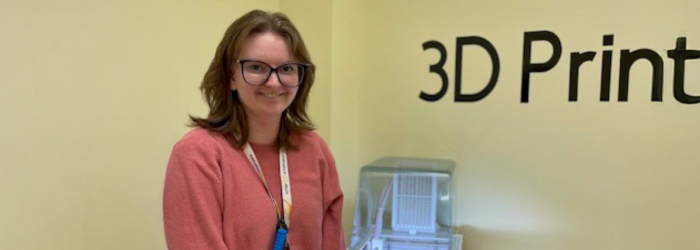Image of Emily at a 3d printer