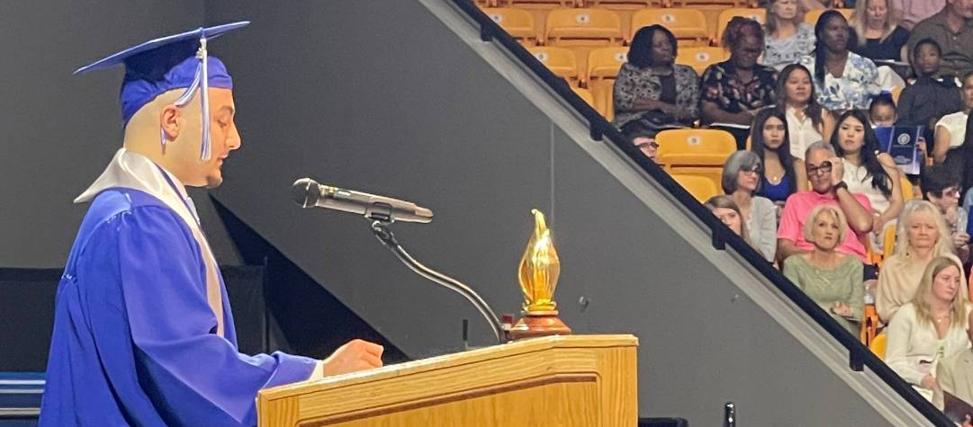 Nour Issa speaks to graduates and supporters at JCC Spring Commencement