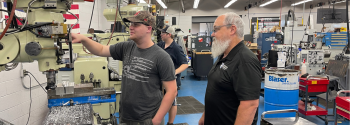 Photo fo student working with Lathe Machine