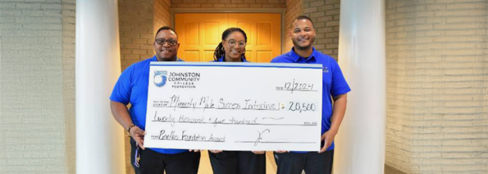 Photo of MMSI Coordinator and Staff excepting a very large check