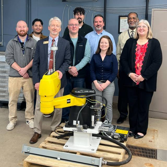 Photo of JCC Staff and Robot donation