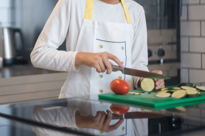 Chef cutting vegetable