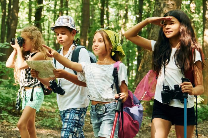 Kids hiking in woods