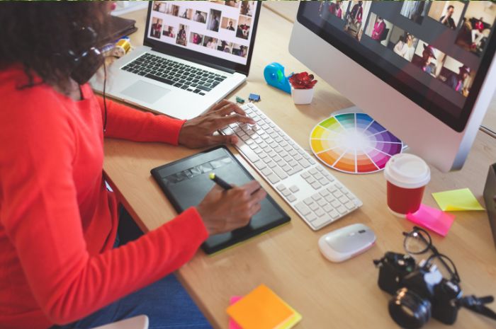 Woman working on computer photography