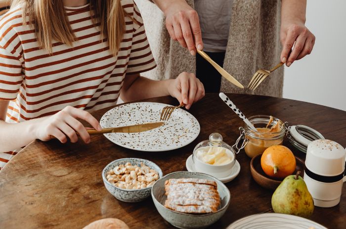 Table setting and napkins on laps