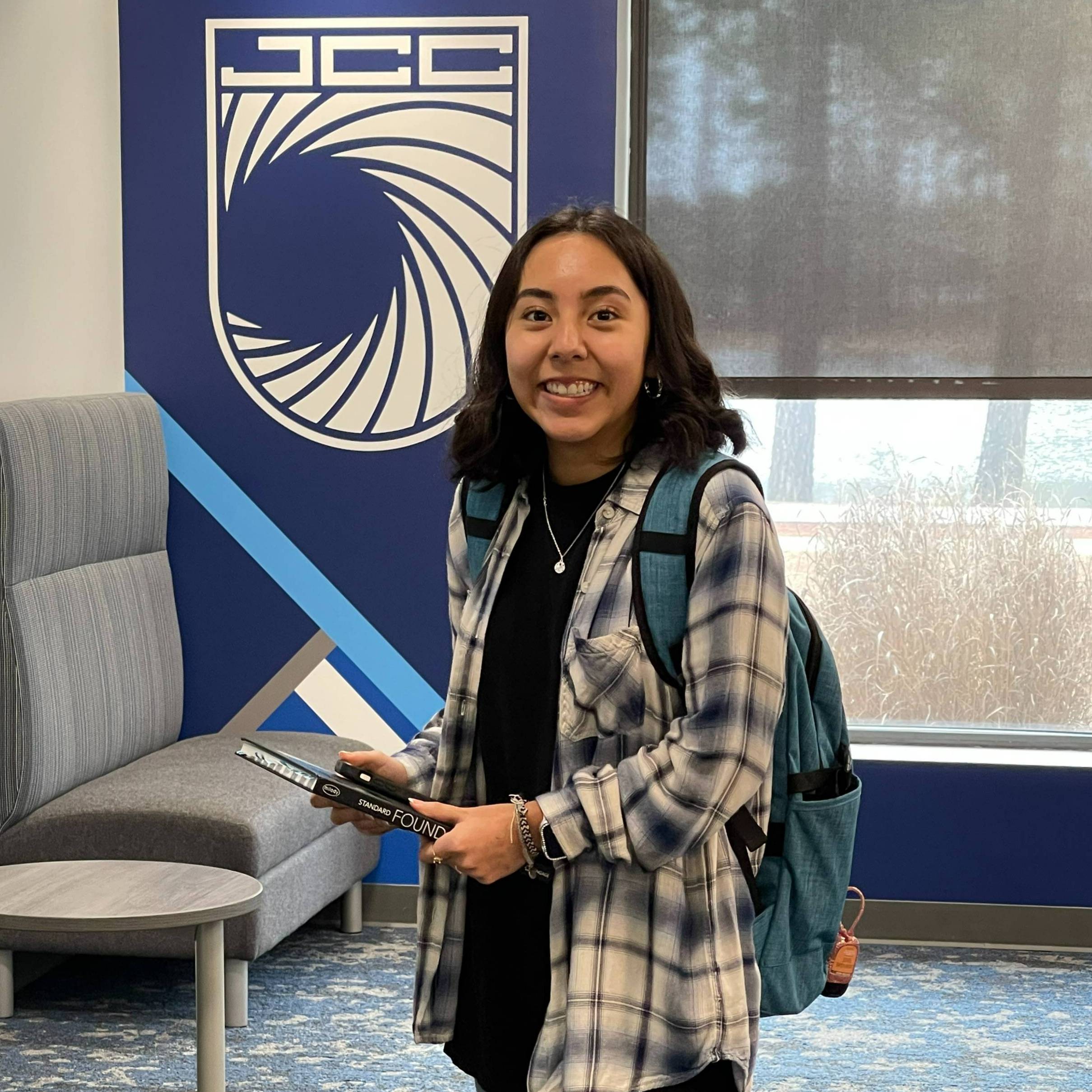 Female student standing in Student Success Center