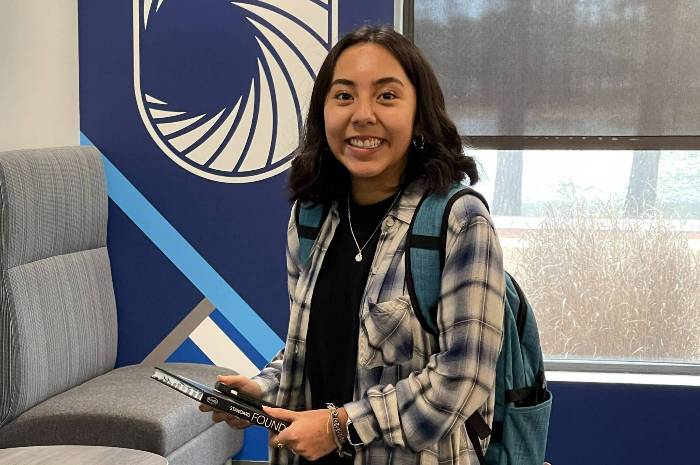 Female student standing in Student Success Center