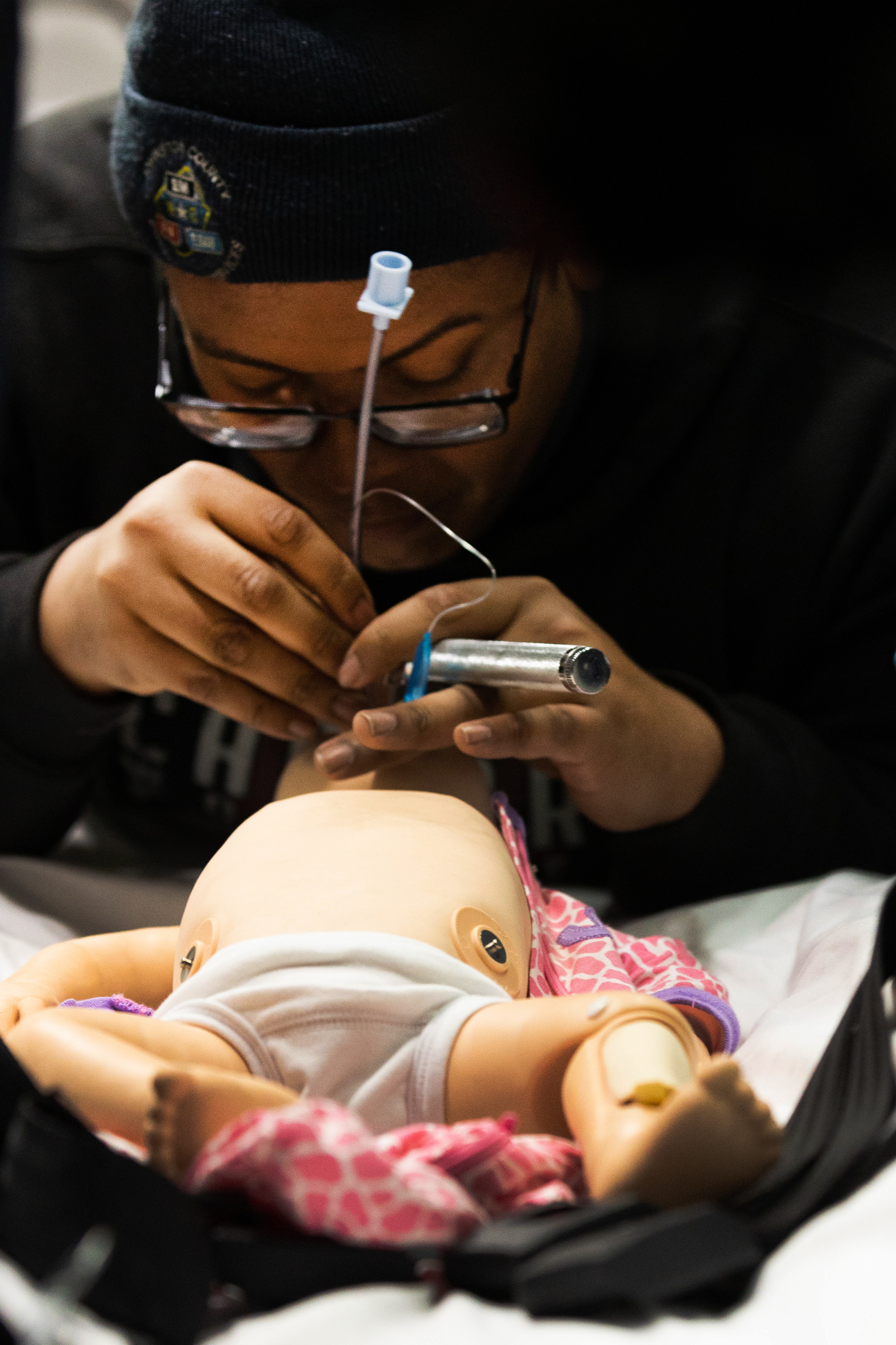 student working on doll