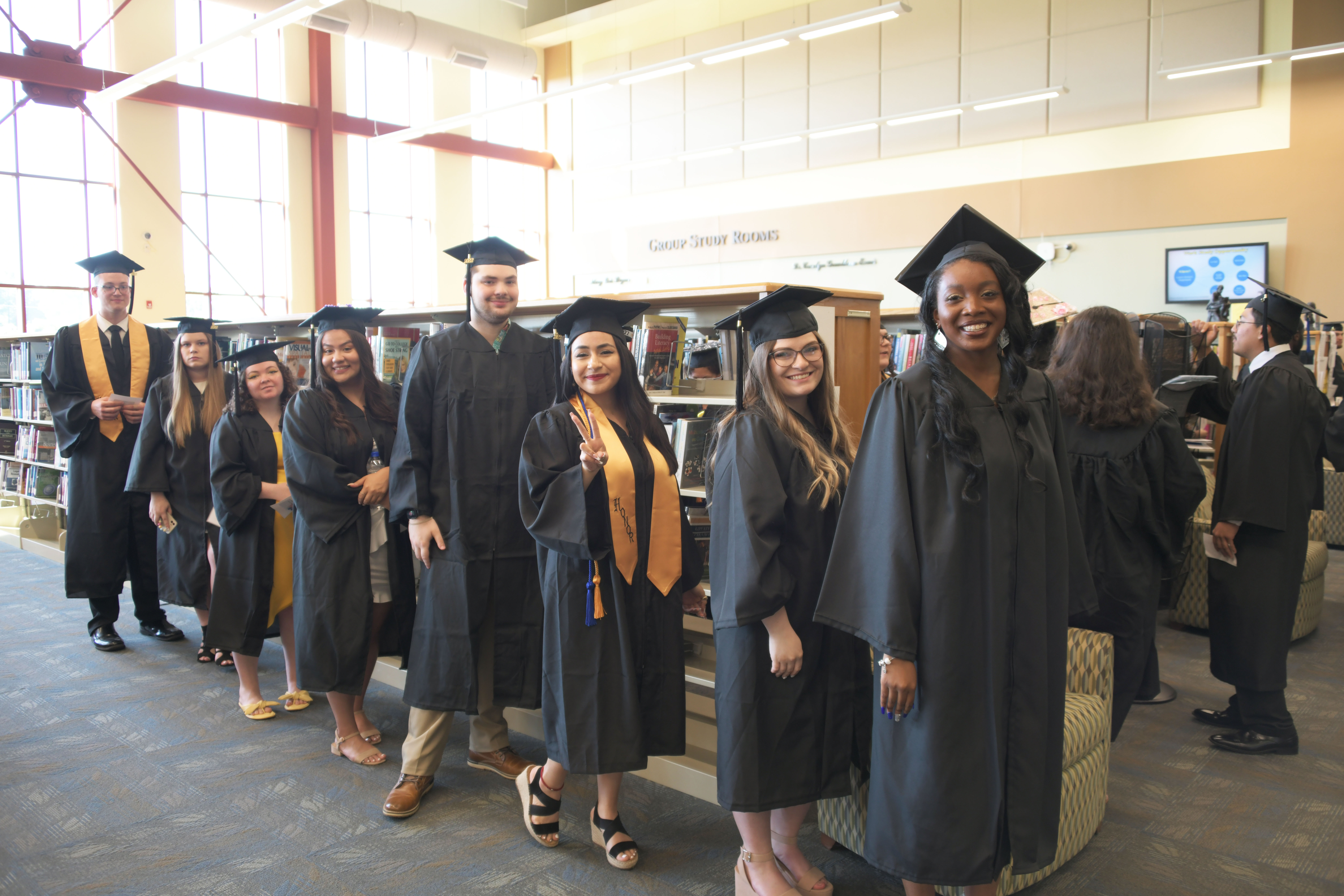 students at commencement in caps and gowns